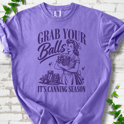 Violet Comfort Colors® T-shirt with retro “Grab Your Balls, It’s Canning Season” design featuring a canner holding jars