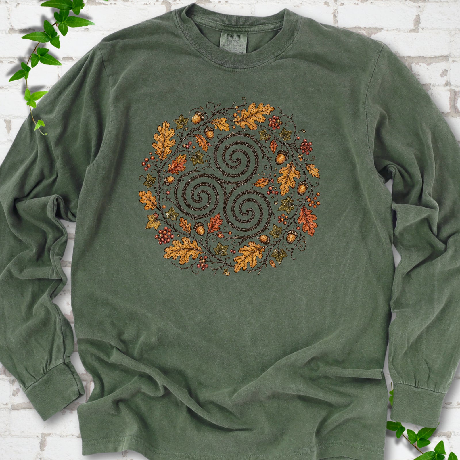 Hemp Comfort Colors® long sleeve T-shirt flat lay with a Celtic-inspired triskele and autumn oak wreath design.