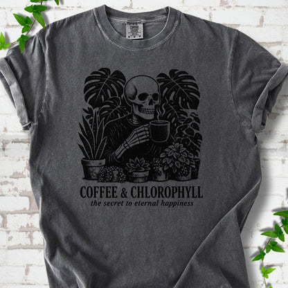Pepper Comfort Colors® short sleeve T-shirt flat lay featuring a distressed skeleton drinking coffee among houseplants