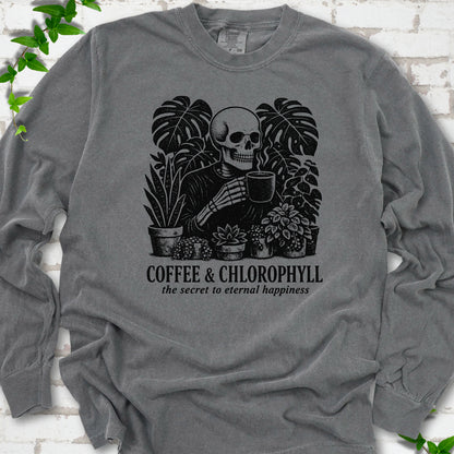 Pepper Comfort Colors® long sleeve T-shirt flat lay featuring a distressed skeleton drinking coffee among houseplants