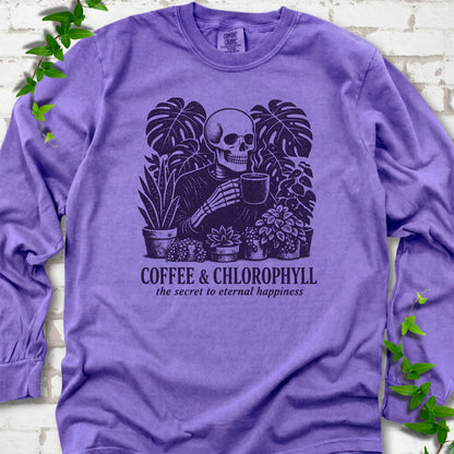 Violet Comfort Colors® long sleeve T-shirt flat lay featuring a distressed skeleton drinking coffee among houseplants
