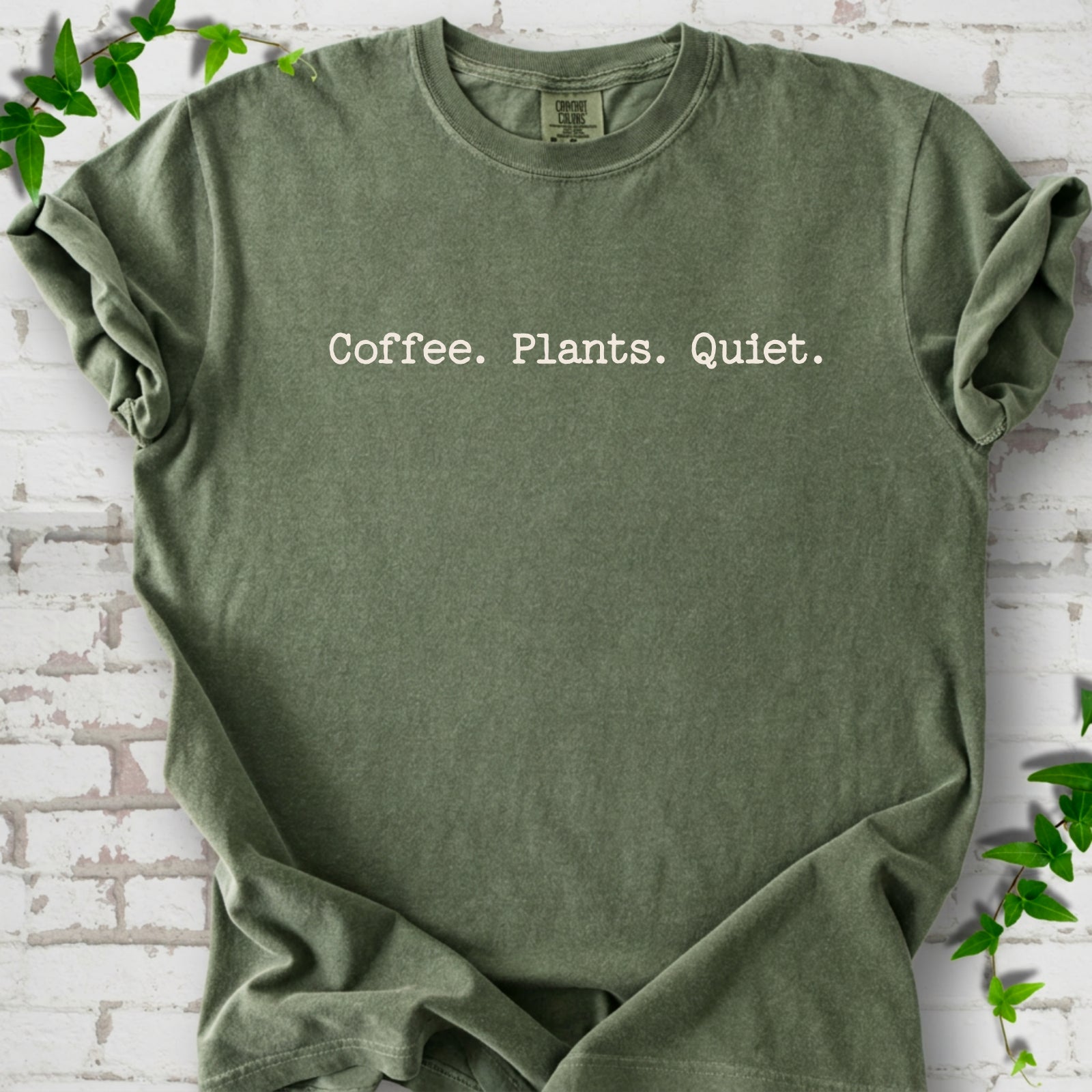 Moss Comfort Colors® T-shirt showing the Coffee. Plants. Quiet. text design