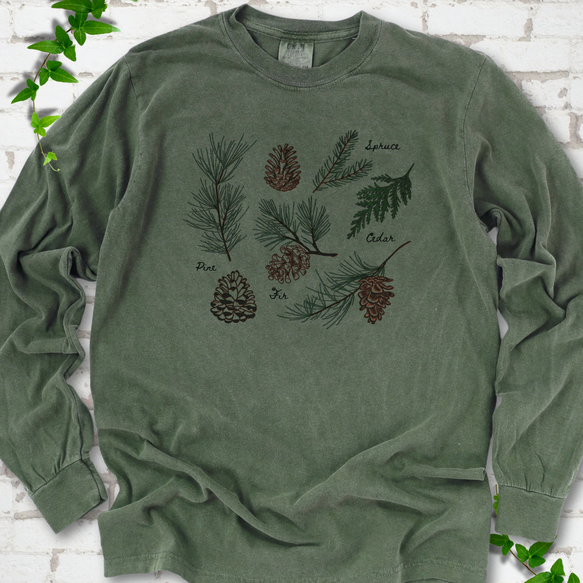Hemp Comfort Colors® long sleeve T-shirt shown flat with a botanical chart of pine, spruce, cedar and fir cones and needles