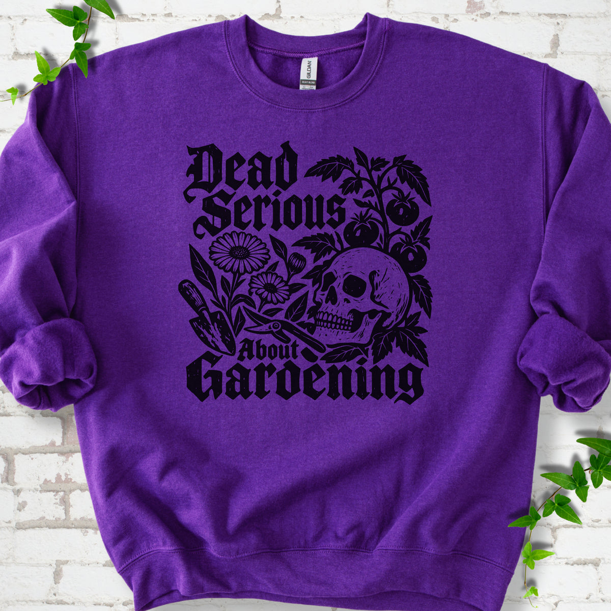 Purple classic sweatshirt with cream Dead Serious About Gardening graphic