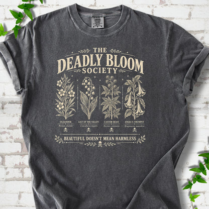 Pepper Comfort Colors® T-shirt flat lay featuring The Deadly Bloom Society poisonous plant design.