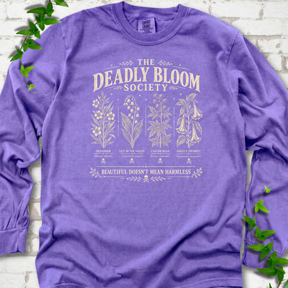 Violet Comfort Colors® long sleeve T-shirt flat lay featuring The Deadly Bloom Society poisonous plant design.
