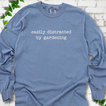 Blue Jean Comfort Colors® long sleeve shirt with Easily Distracted by Gardening text design.