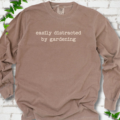 Espresso Comfort Colors® long sleeve shirt with Easily Distracted by Gardening text design.