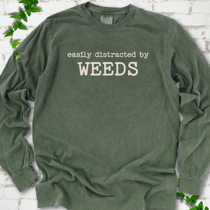 Hemp Comfort Colors® long sleeve T-shirt shown flat with cream "Easily Distracted by Weeds" gardening slogan