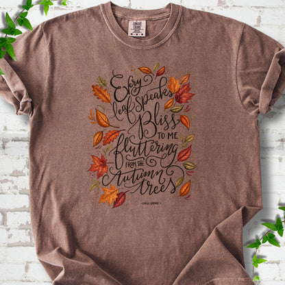 Espresso Comfort Colors® T-shirt flat lay with the Every Leaf Speaks Bliss Emily Brontë quote and autumn leaves.