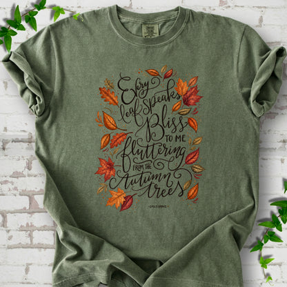 Moss Comfort Colors® T-shirt flat lay with the Every Leaf Speaks Bliss Emily Brontë quote and autumn leaves.