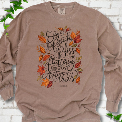 Espresso Comfort Colors® long sleeve T-shirt flat lay with the Every Leaf Speaks Bliss Emily Brontë quote and autumn leaves.