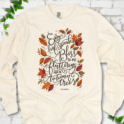 Ivory Comfort Colors® long sleeve T-shirt flat lay with the Every Leaf Speaks Bliss Emily Brontë quote and autumn leaves.