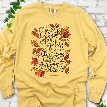 Mustard Comfort Colors® long sleeve T-shirt flat lay with the Every Leaf Speaks Bliss Emily Brontë quote and autumn leaves.