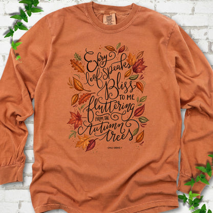 Yam Comfort Colors® long sleeve T-shirt flat lay with the Every Leaf Speaks Bliss Emily Brontë quote and autumn leaves.