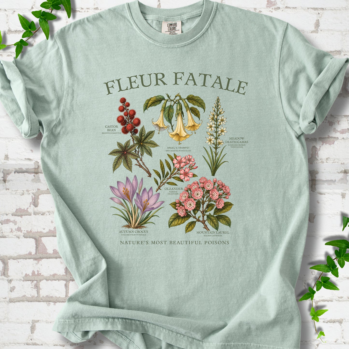 Bay Comfort Colors® T-shirt flat lay featuring a Fleur Fatale botanical chart of six poisonous flowering plants.
