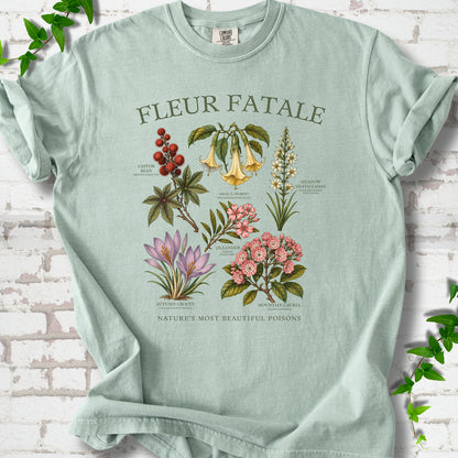 Bay Comfort Colors® T-shirt flat lay featuring a Fleur Fatale botanical chart of six poisonous flowering plants.