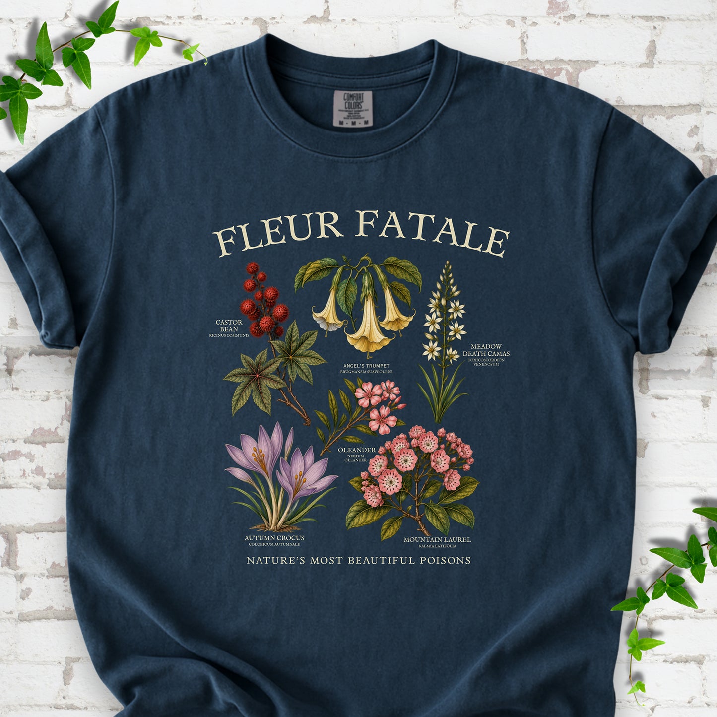 Midnight Comfort Colors® T-shirt flat lay featuring a Fleur Fatale botanical chart of six poisonous flowering plants.