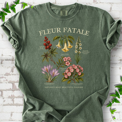Moss Comfort Colors® T-shirt flat lay featuring a Fleur Fatale botanical chart of six poisonous flowering plants.