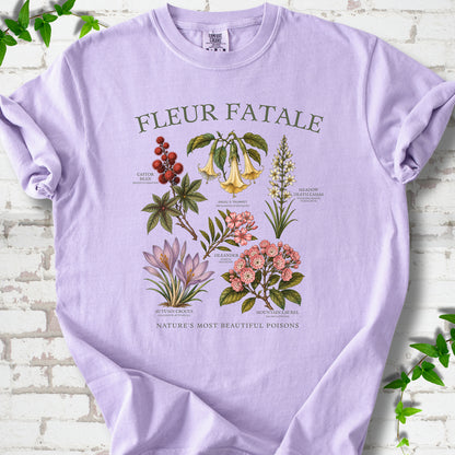 Orchid Comfort Colors® T-shirt flat lay featuring a Fleur Fatale botanical chart of six poisonous flowering plants.