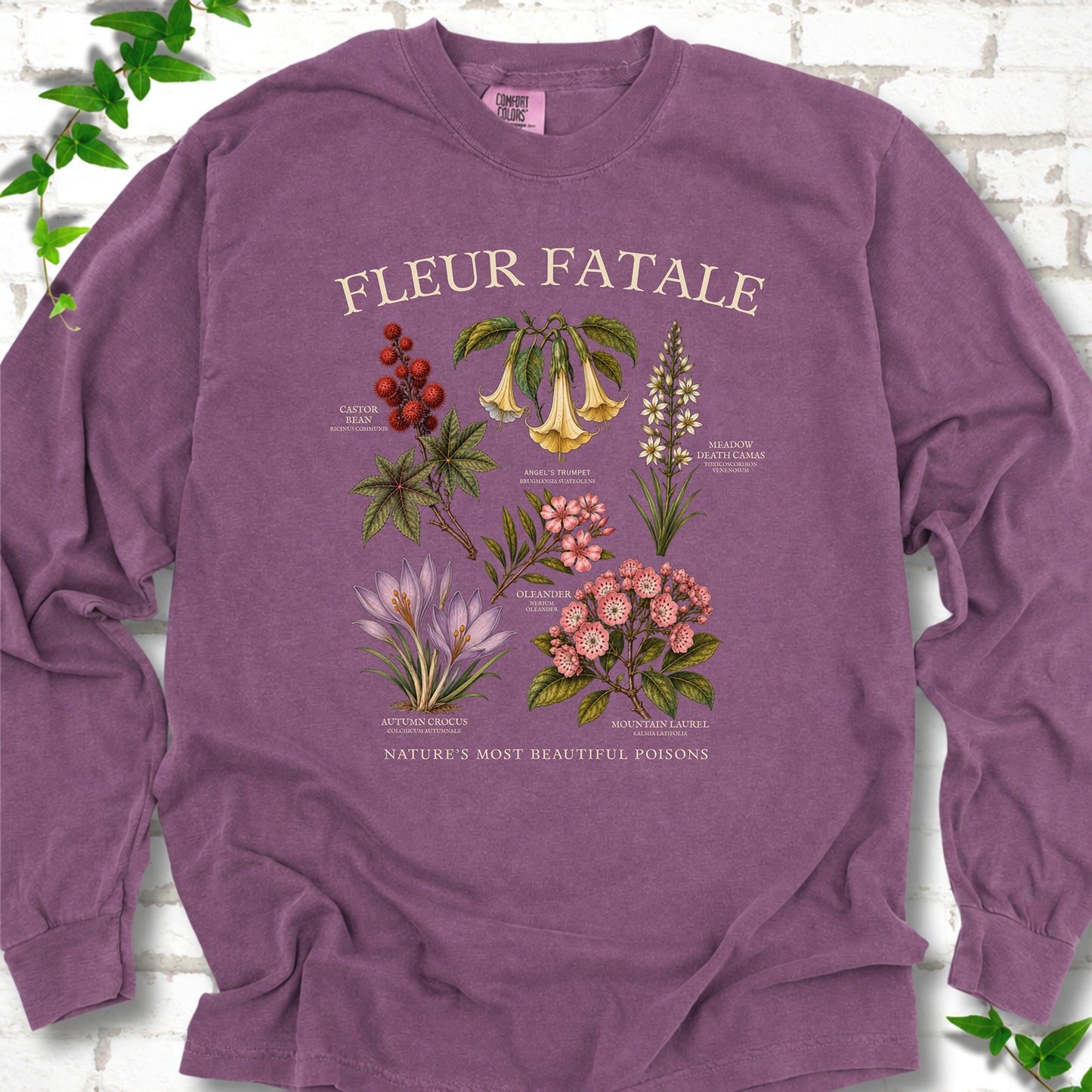 Berry Comfort Colors® long sleeve T-shirt flat lay featuring a Fleur Fatale botanical chart of six poisonous flowering plants.