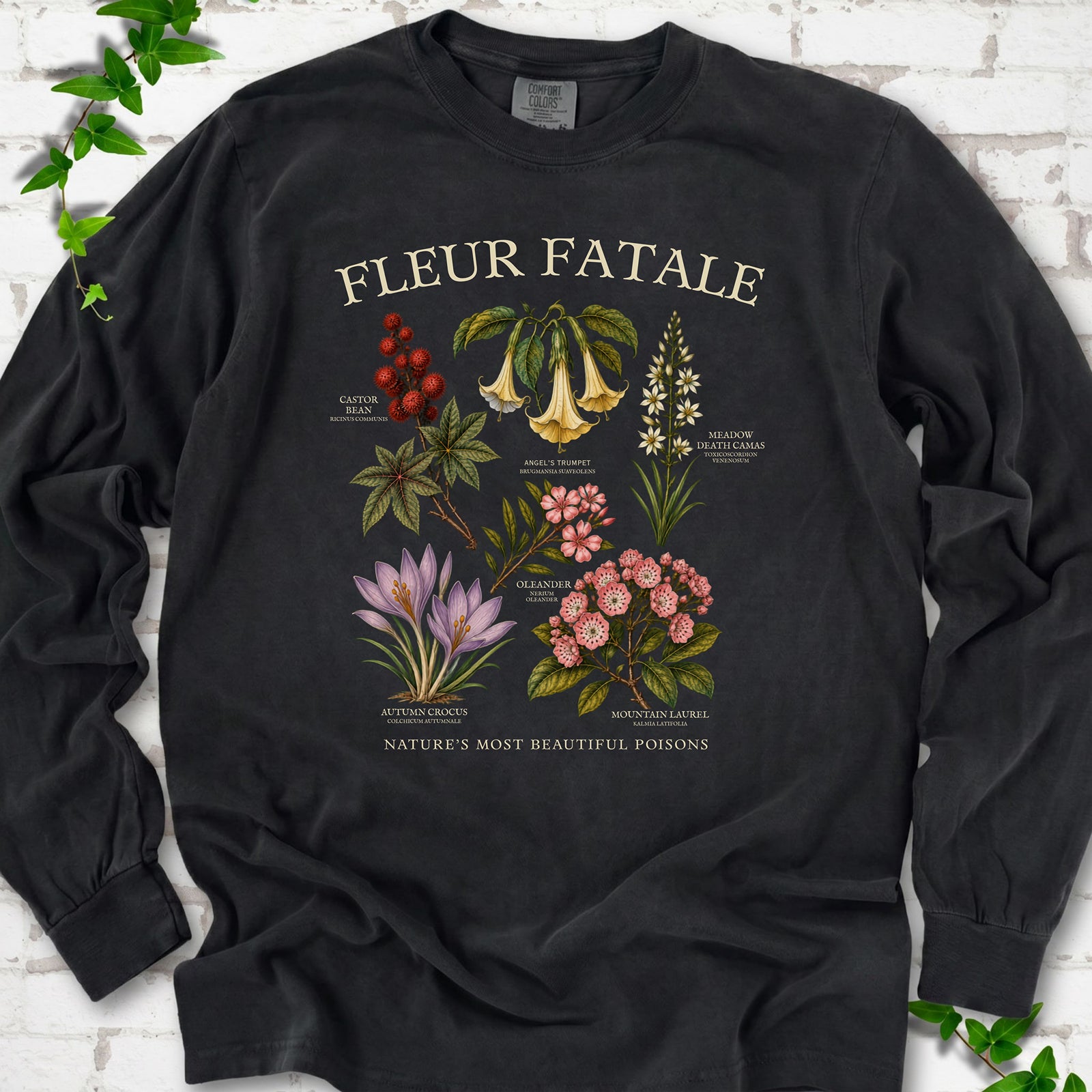 Black Comfort Colors® long sleeve T-shirt flat lay featuring a Fleur Fatale botanical chart of six poisonous flowering plants.