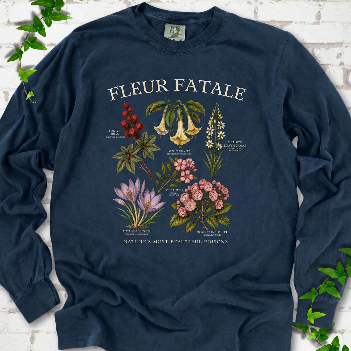 Midnight Comfort Colors® long sleeve T-shirt flat lay featuring a Fleur Fatale botanical chart of six poisonous flowering plants.