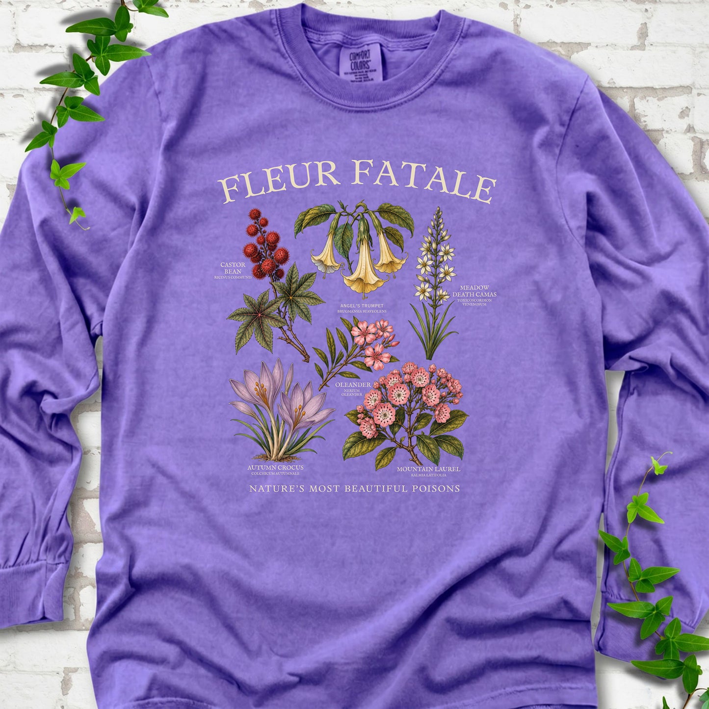 Violet Comfort Colors® long sleeve T-shirt flat lay featuring a Fleur Fatale botanical chart of six poisonous flowering plants.