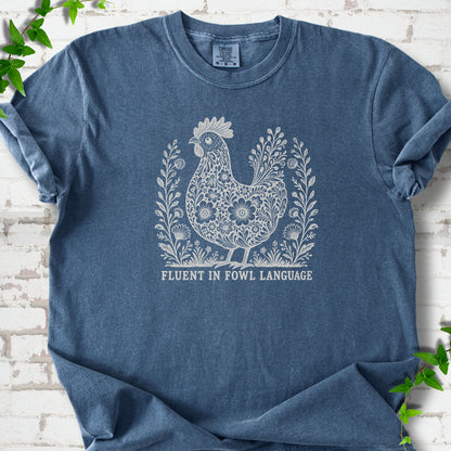 Denim Comfort Colors® T-shirt with cream floral hen and Fluent in Fowl Language text