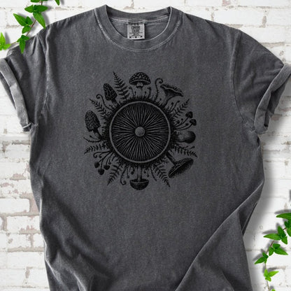 Pepper gray short-sleeve tee with a mushroom gill circle ringed by ferns, morels and mushrooms in black ink.