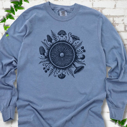 Blue Jean long-sleeve tee with a mushroom gill circle ringed by ferns, morels and mushrooms in navy ink.