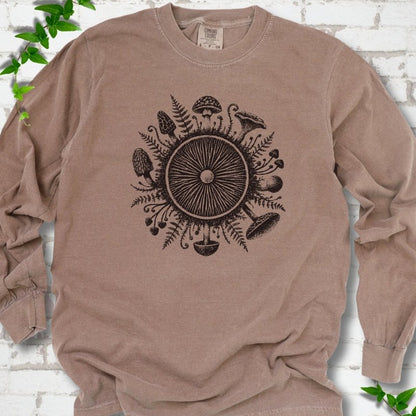 Espresso brown long-sleeve tee with a mushroom gill circle ringed by ferns, morels and mushrooms in dark brown ink.