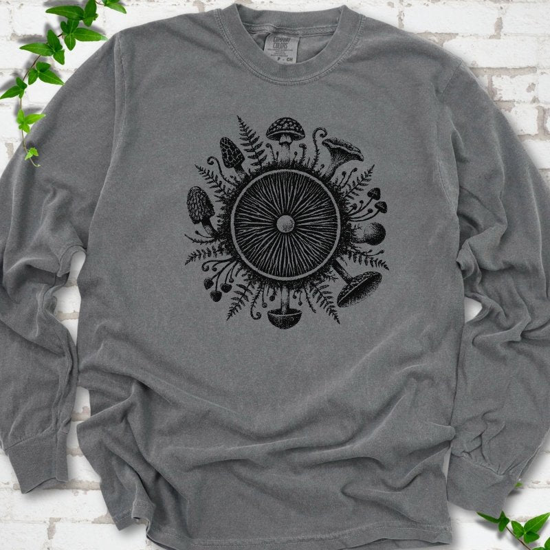 Pepper gray long-sleeve tee with a mushroom gill circle ringed by ferns, morels and mushrooms in black ink.