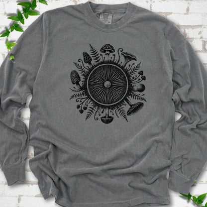 Pepper gray long-sleeve tee with a mushroom gill circle ringed by ferns, morels and mushrooms in black ink.