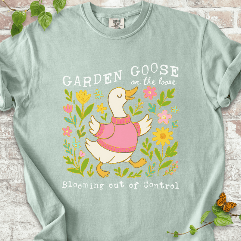 Silly gardening goose graphic on a Bay Comfort Colors™ T-shirt with a flower-loving goose in full bloom.
