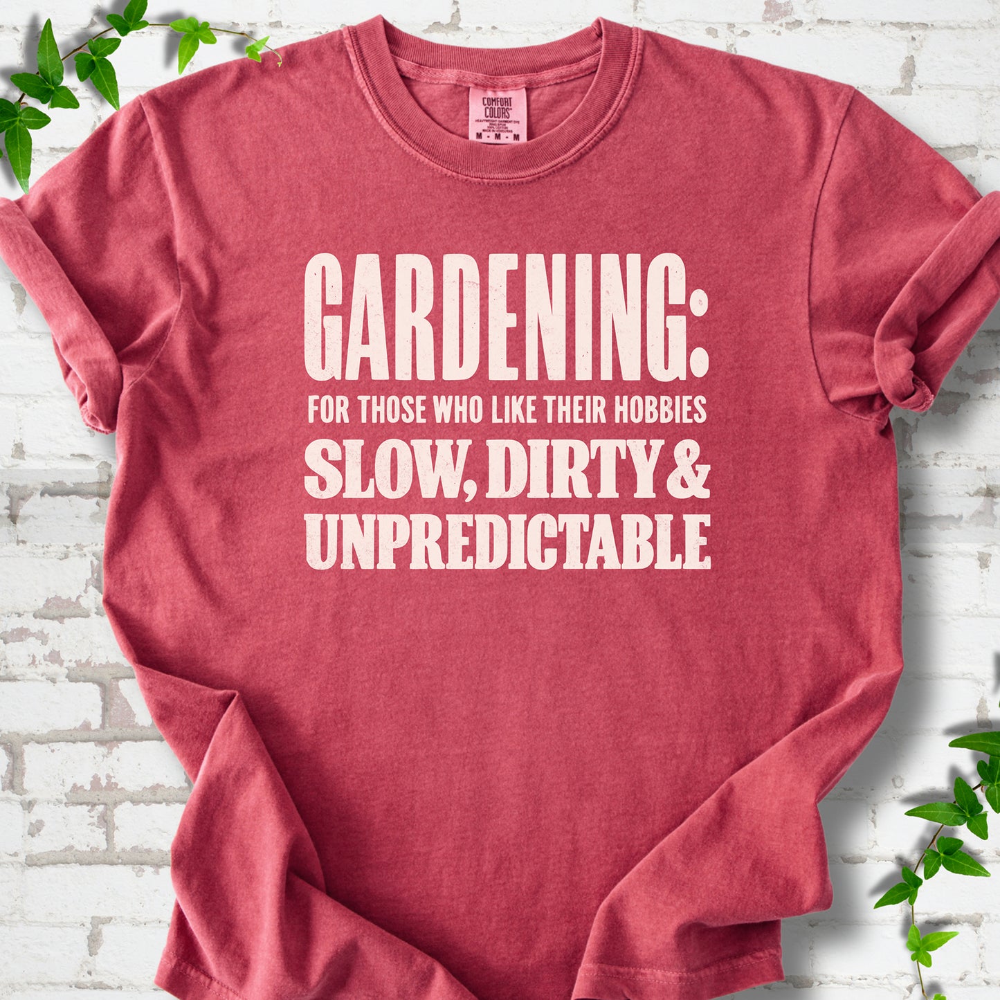 Crimson Comfort Colors® T-shirt with white “Gardening: For Those Who Like Their Hobbies Slow, Dirty & Unpredictable” typography