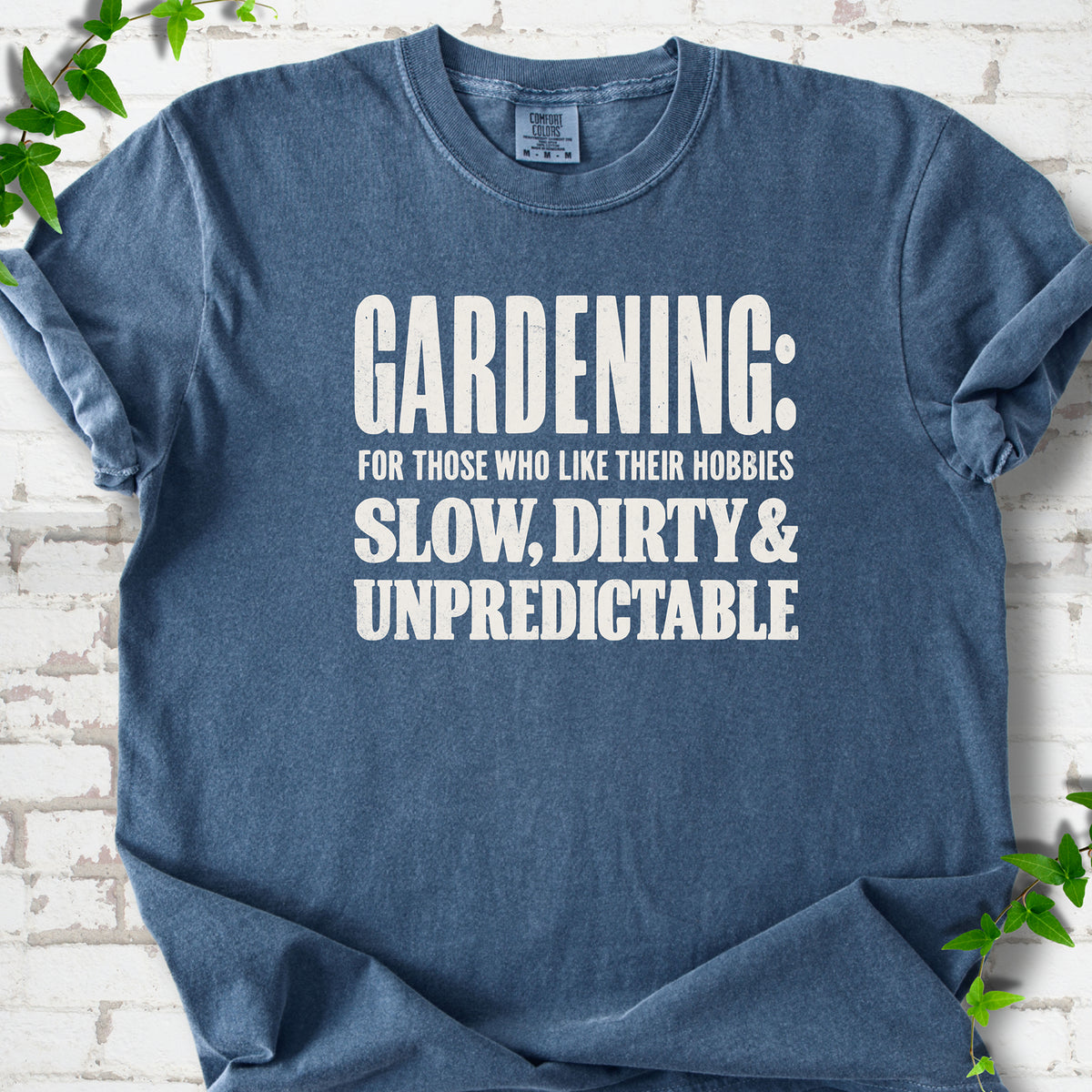Denim Comfort Colors® T-shirt with white “Gardening: For Those Who Like Their Hobbies Slow, Dirty & Unpredictable” typography
