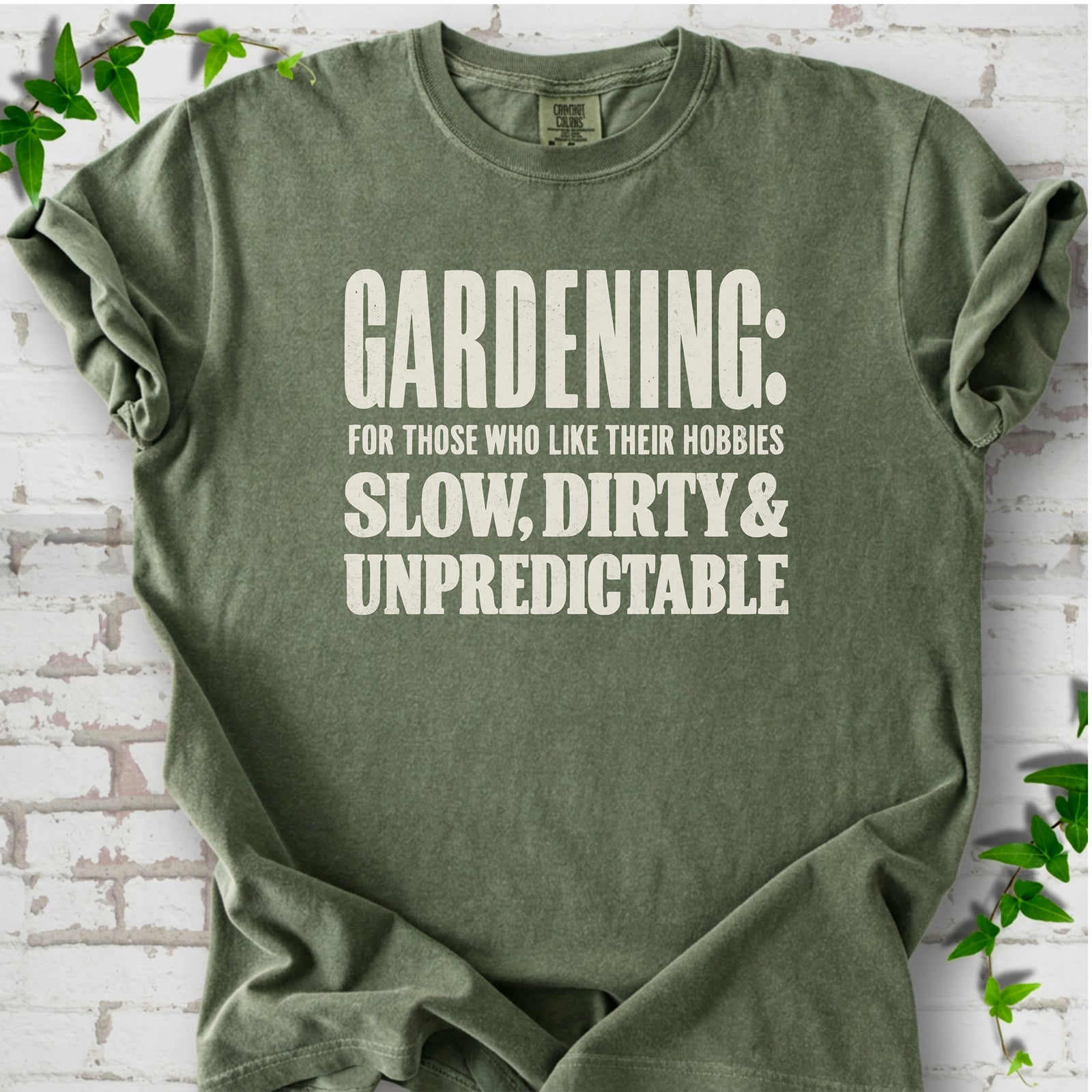 Moss Comfort Colors® T-shirt with white “Gardening: For Those Who Like Their Hobbies Slow, Dirty & Unpredictable” typography