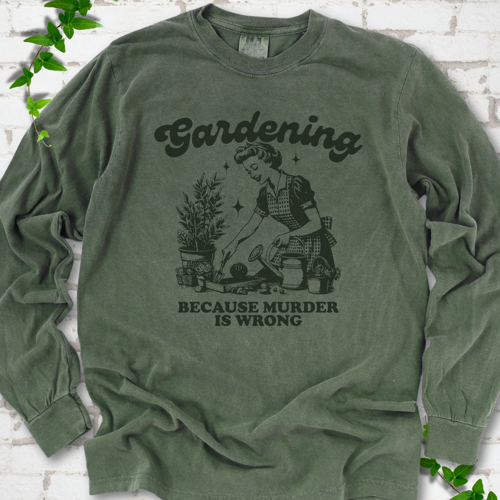 Hemp Comfort Colors® long sleeve T-shirt flat lay with retro Gardening Because Murder is Wrong artwork.