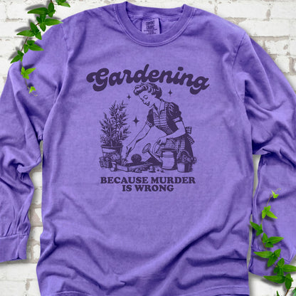 Violet Comfort Colors® long sleeve T-shirt flat lay with retro Gardening Because Murder is Wrong artwork.