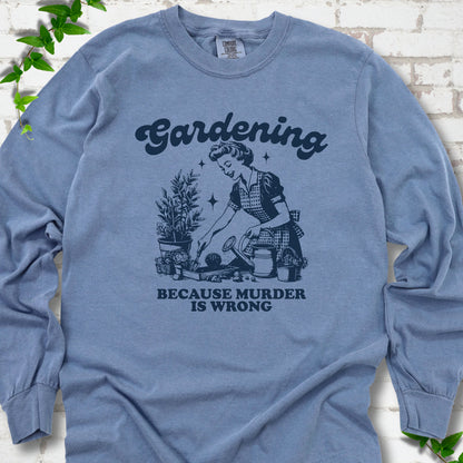 Blue Jean Comfort Colors® long sleeve T-shirt flat lay with retro Gardening Because Murder is Wrong artwork.
