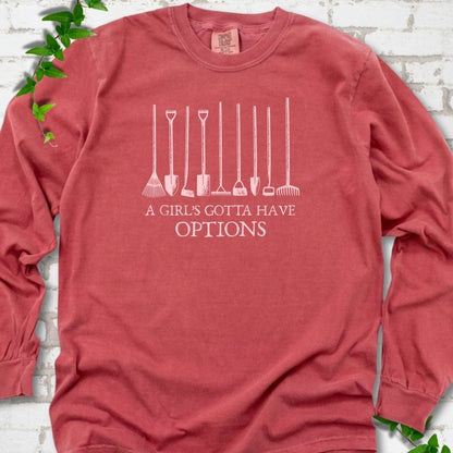 Crimson Comfort Colors® long sleeve T-shirt with A Girl's Gotta Have Options garden tools graphic