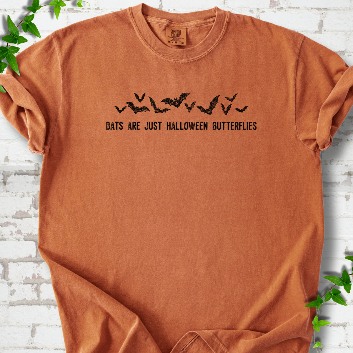 Yam Comfort Colors® T-shirt flat lay with black flying bats and “Bats Are Just Halloween Butterflies” lettering.