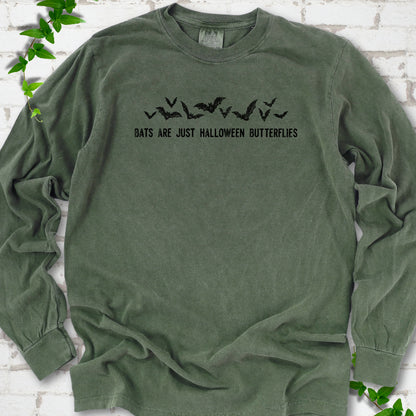 Hemp Comfort Colors® long sleeve tee flat lay with black flying bats and “Bats Are Just Halloween Butterflies” lettering.