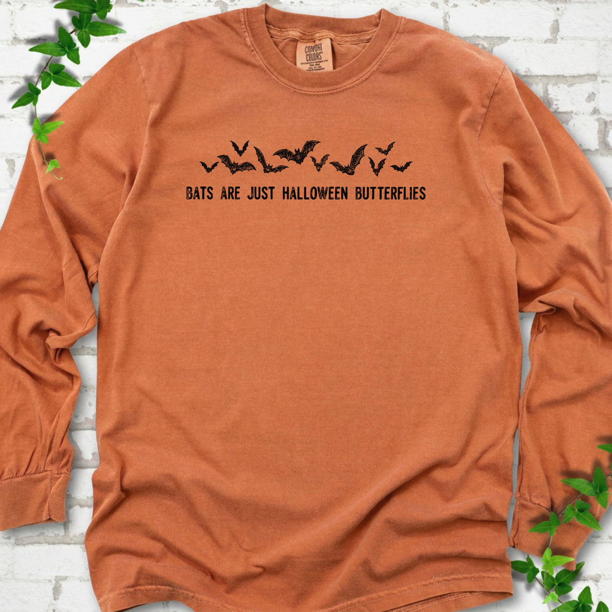 Yam Comfort Colors® long sleeve tee flat lay with black flying bats and “Bats Are Just Halloween Butterflies” lettering.