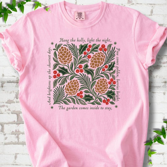 Blossom Comfort Colors® T-shirt shown flat with green holly, red berries, pine cones and the "Hang the Holly" seasonal verse