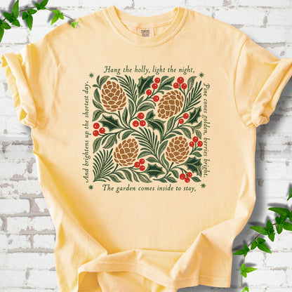 Butter Comfort Colors® T-shirt shown flat with green holly, red berries, pine cones and the "Hang the Holly" seasonal verse