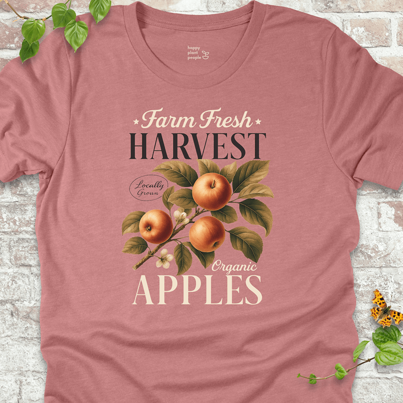 Muted mauve tee featuring vintage apple harvest design. A soft and feminine fall favorite for garden lovers.