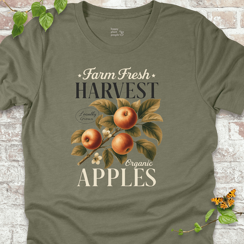 Soft olive green Bella+Canvas tee with hand-drawn apple harvest print. Perfect for fall gifting and orchard outings.