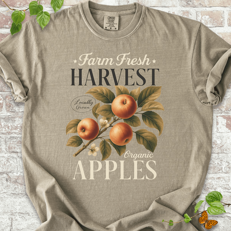 Harvest Apples T-shirt on Comfort Colors™ Khaki – features a cozy harvest graphic with detailed apple artwork and text reading “Locally Grown Organic Apples”